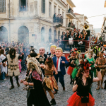 Colorful Apokries celebration in Greece with locals wearing carnival masks and costumes during the traditional Greek Carnival before Lent