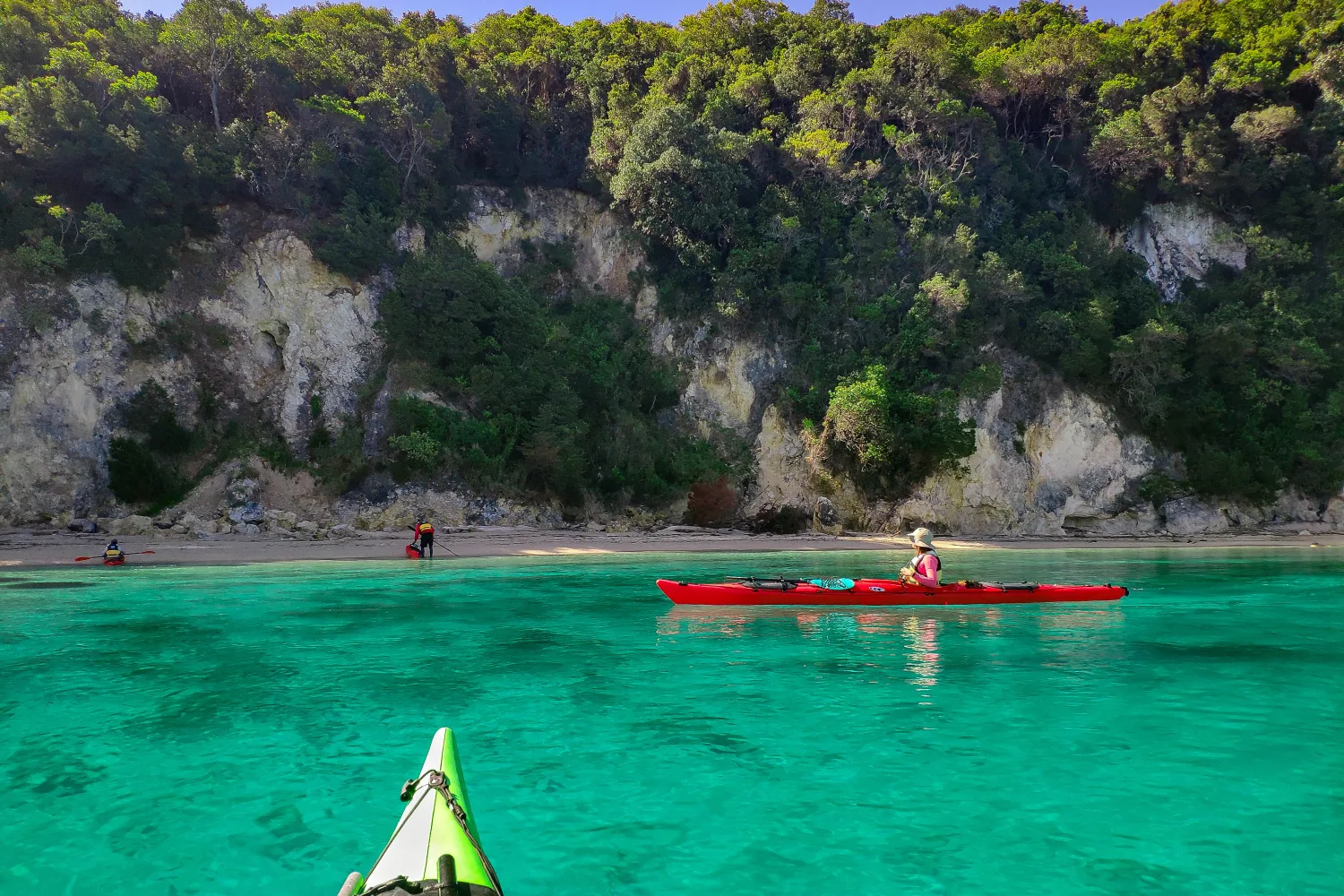 Kayaking in turquoise waters at Blue Lagoon Beach during a guided sea kayak tour from Sivota, surrounded by pristine Ionian coastline
