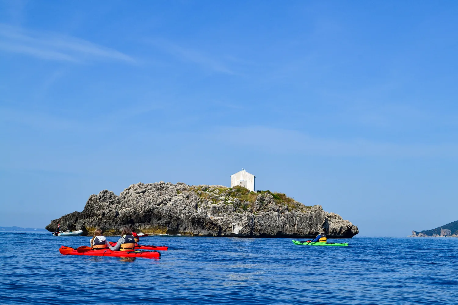 Sea kayaking around small islands near Parga in the Ionian Sea, exploring hidden coastal landscapes