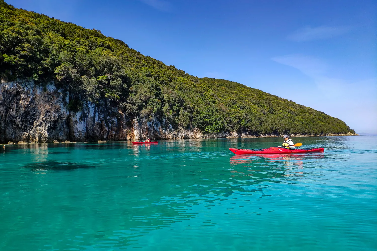 Sea kayaking in Sivota, exploring the Blue Lagoon Beach and surrounding Ionian islands in crystal-clear waters